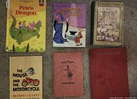 Seven vintage children's books arranged front cover visible, various titles and conditions.