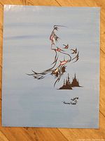 Full view of the first painting showing a light blue background and a stylized Native elder profile with birds and forest imagery, signed by Randy Knott.