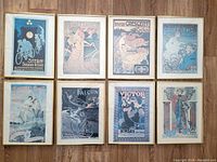 Photo showing all 8 framed Art Deco bicycle advertisement prints arranged in two rows of four, clear view of artwork and frame size.