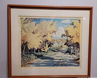 Full front view of the framed lithograph showing autumn road scene with trees and sky.