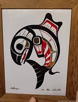 Full framed tile showing the art of a salmon in black, red, white, and gold, signed by artist Ben Houstie.