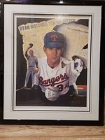 Framed print showing Nolan Ryan in Rangers uniform with action poses and newspaper background.