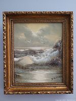 Frontal photo of the framed oil painting showing crashing waves, rocky coastline, seagulls, and the signature Digurski