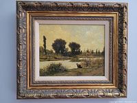 Full view of the framed oil painting showing the landscape scene and ornate gold frame.