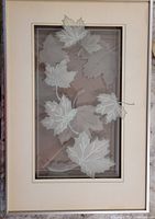 Full framed glass art piece with layered sandblasted maple leaves.