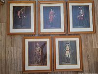 Five framed lithographs arranged on the floor showing the full lot.