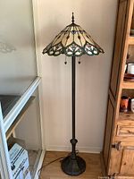 Full view of lamp showing base, stem and shade