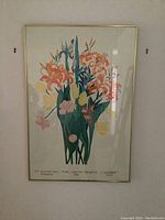 Full view of framed floral poster with vintage artwork and text at bottom.