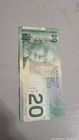 Front side of the 2004 Canadian 20 dollar bill showing the portrait and denomination.