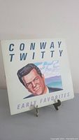 Front cover of the Conway Twitty vinyl record titled "Early Favorites" showing an illustrated portrait of the artist with text.