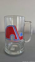Front view of clear glass mug showing the Quebec Nordiques red and blue logo with text 'Circa 1979/80'.