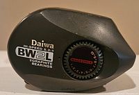 Side view of Daiwa BW2L fishing reel showing model, bearing type, gear ratio and Magforce brake system branding.