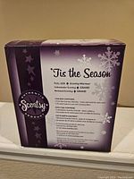 Original packaging box showing 'Tis the Season theme, Scentsy branding, and product details.