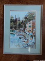 Frontal image showing the entire framed artwork with triple matting and wood frame on a wooden floor.