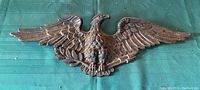 Full view of the heavy metal federal eagle wall hanging showing wingspan and overall design