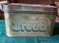Front side of the vintage Better Baked metal bread box showing branding and natural storage advertisement.