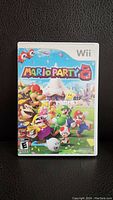 Front cover of the Mario Party 8 game case showing the title and characters from the game.