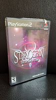 Front of the PS2 game case showing the title Star Ocean: Till the End of Time with purple cosmic background.