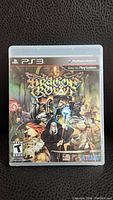 Front of the PS3 game case showing Dragon's Crown cover art with fantasy characters.