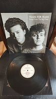 Front cover of the vinyl record album 'Songs From The Big Chair' by Tears For Fears shows band members in black and white photo with album title and band name.