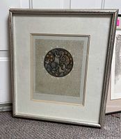 Framed print showing entire artwork and frame condition including scratches on the frame.