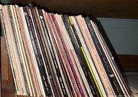 Side view of a collection of classical music vinyl records showing titles by Tchaikovsky, Beethoven, Schumann, and others.