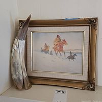 Photo showing the framed print alongside the Duckhead horncraft, highlighting the painting and horn sculpture