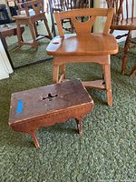 Photo showing both the vintage wooden sewing chair and the small wooden bench on green carpet.