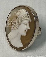 Close-up of the oval carved cameo showing a woman's profile set into a 925 silver ring.