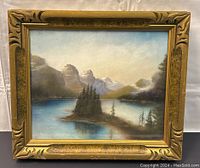 Frontal view of the framed pastel painting showing the scenic landscape and ornate gold frame