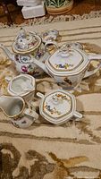 MZ Altrohlau set: teapot, sugar bowl, creamer, two reticulated dishes on patterned rug