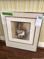 Framed limited edition signed print of a man riding a bull with signature and numbering.