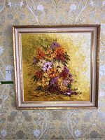 Front view of the framed painting mounted on a patterned wallpapered wall.