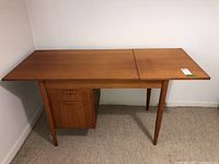 Full front-angle view of desk showing top, legs, and pedestal drawers