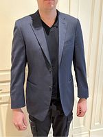 Front view of navy blue blazer on model torso