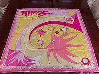 Top-down view of scarf laid flat, full design visible