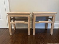 Front view of both tables side by side on hardwood floor