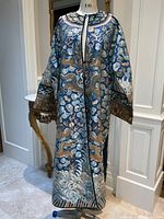 Full front view of blue silk kimono robe on mannequin with embroidered dragons and clouds