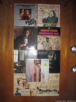 Nine jazz vinyl records arranged on floor, showing cover art and artists such as Wynton Marsalis and Houston Person.