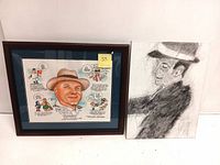 Two framed artworks side-by-side: left is the colorful caricature of Billy Vigeant with cartoon bubbles and right is the black and white signed portrait drawing.