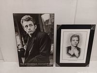 Two framed pictures side by side: larger James Dean photographic poster with quote and smaller Allan Davidson art print portrait.