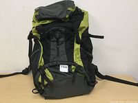 Front view of the hiking backpack showing main compartment and zippered pockets.