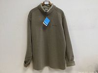 Full view of the tan Columbia sweatshirt showing overall design and color, with tags attached.