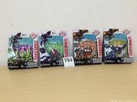 Four Mini-Con Transformers figures brand new in original blister packaging: Dragonus, Divebomb, Beastbox, Sawback