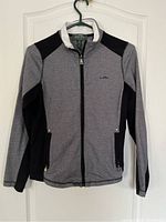 Gray and black Ralph Lauren LRL Active zip hoodie front view showing zipper and pockets