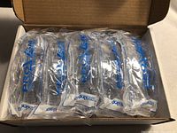 Box containing 10 individually wrapped Chemoplus safety glasses with side shields, visibly branded ProXsafe on the packaging.
