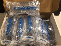 10 sealed Chemoplus safety glasses in original packaging inside a box