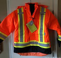 Front view of the orange reflective jacket with Deltro logo and reflective striping