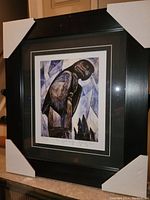 Photo of the overall framed fine art print The Great Eagle by Emily Carr. Protective corner covers still on the frame.