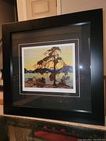 Framed fine art print "Jack Pine" by Tom Thomson showing whole artwork and frame from an angle